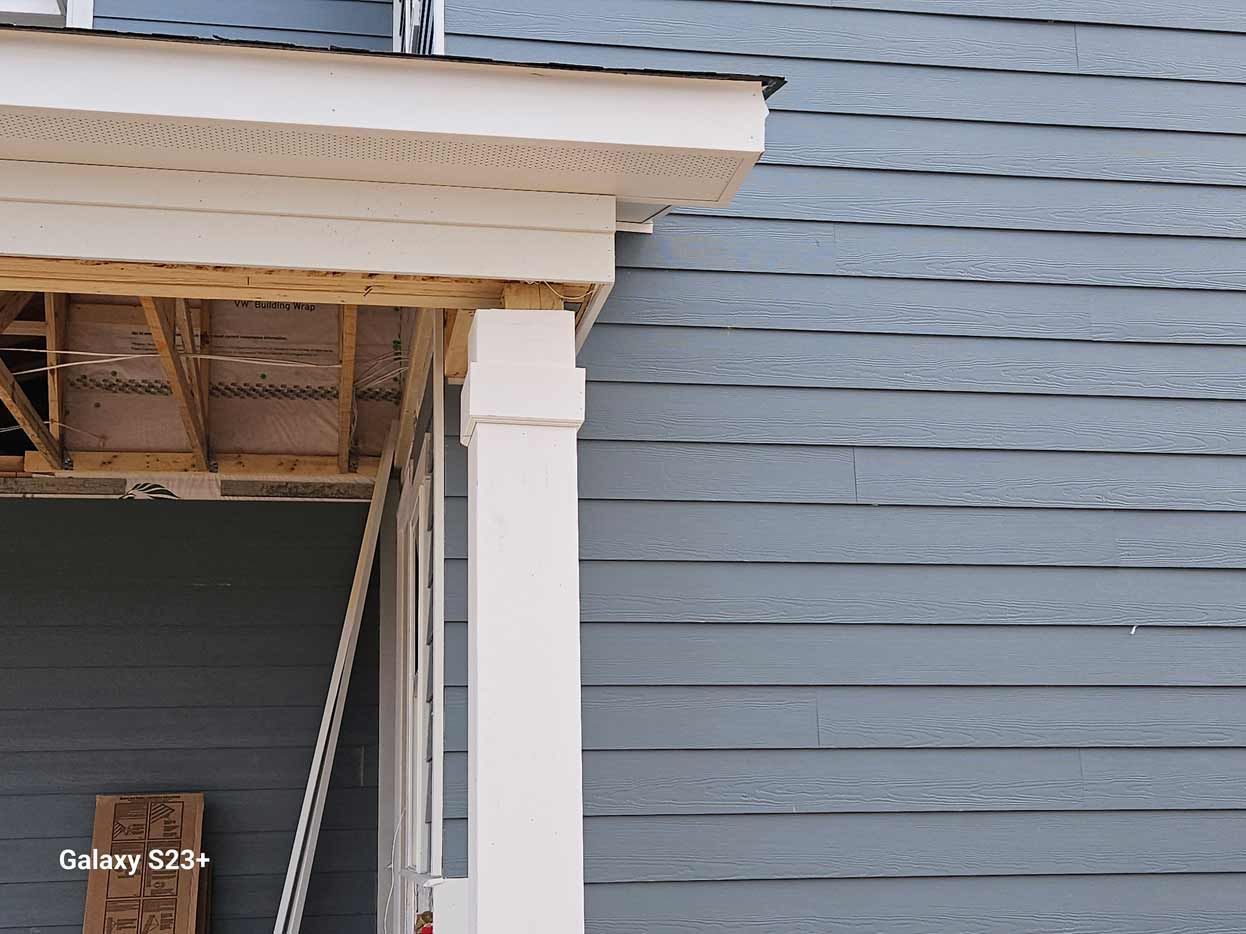 A porch is being built on the side of a house.
