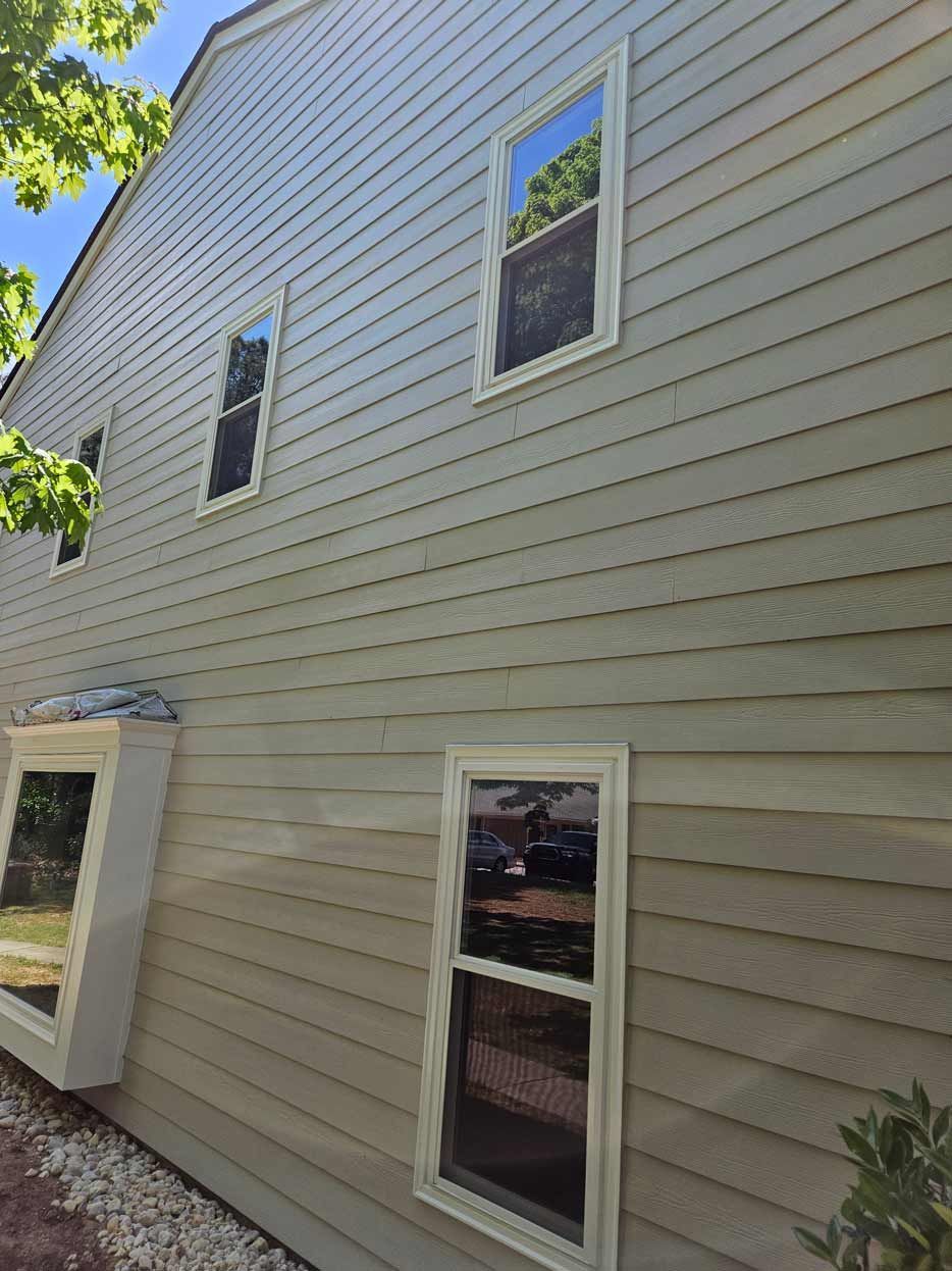 A house with a lot of windows on the side of it.