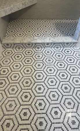 Patterned tiled steps and floor with black-and-white geometric hexagon design
