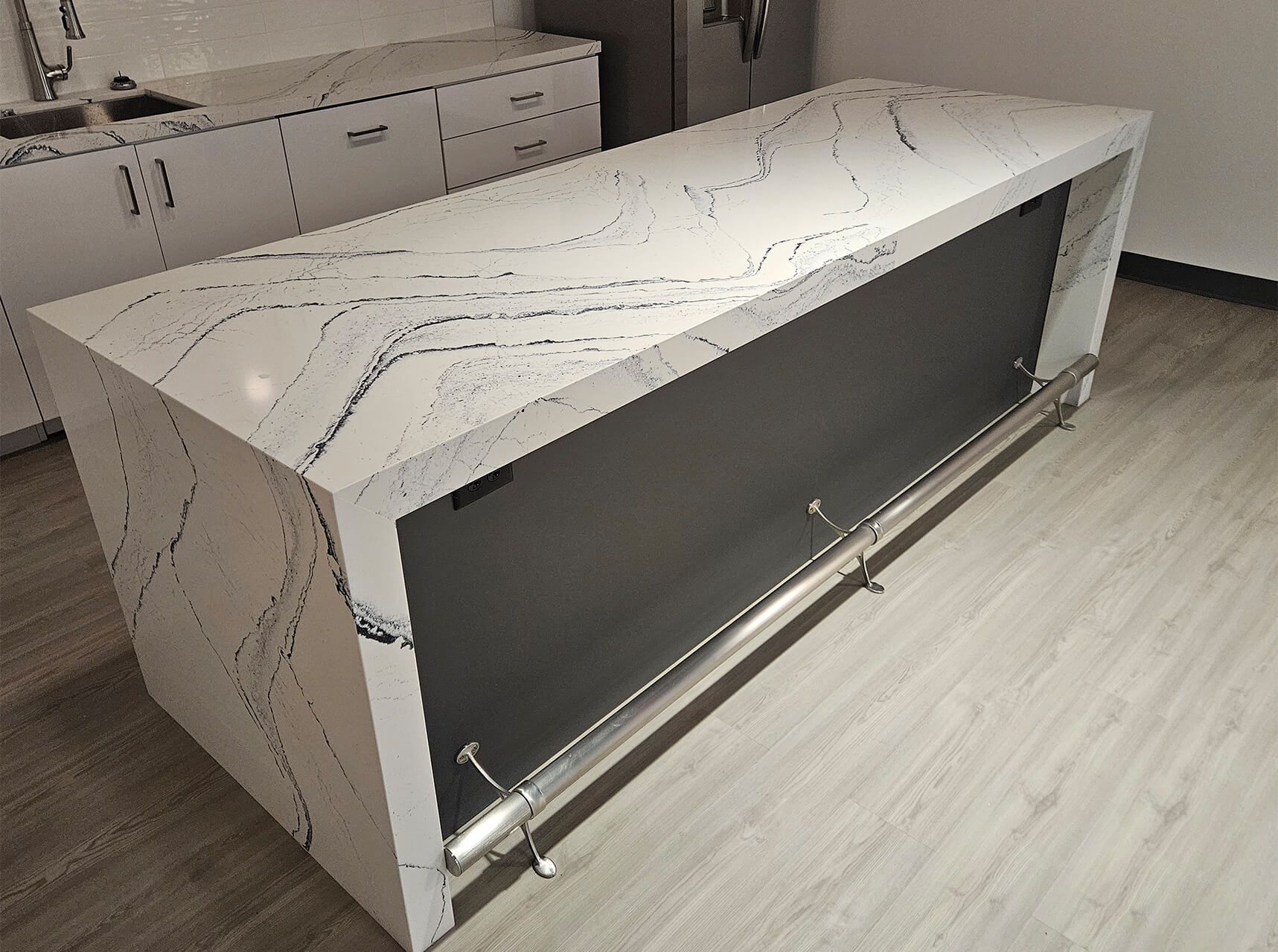 White marble reception desk with dark front panel in a modern interior room