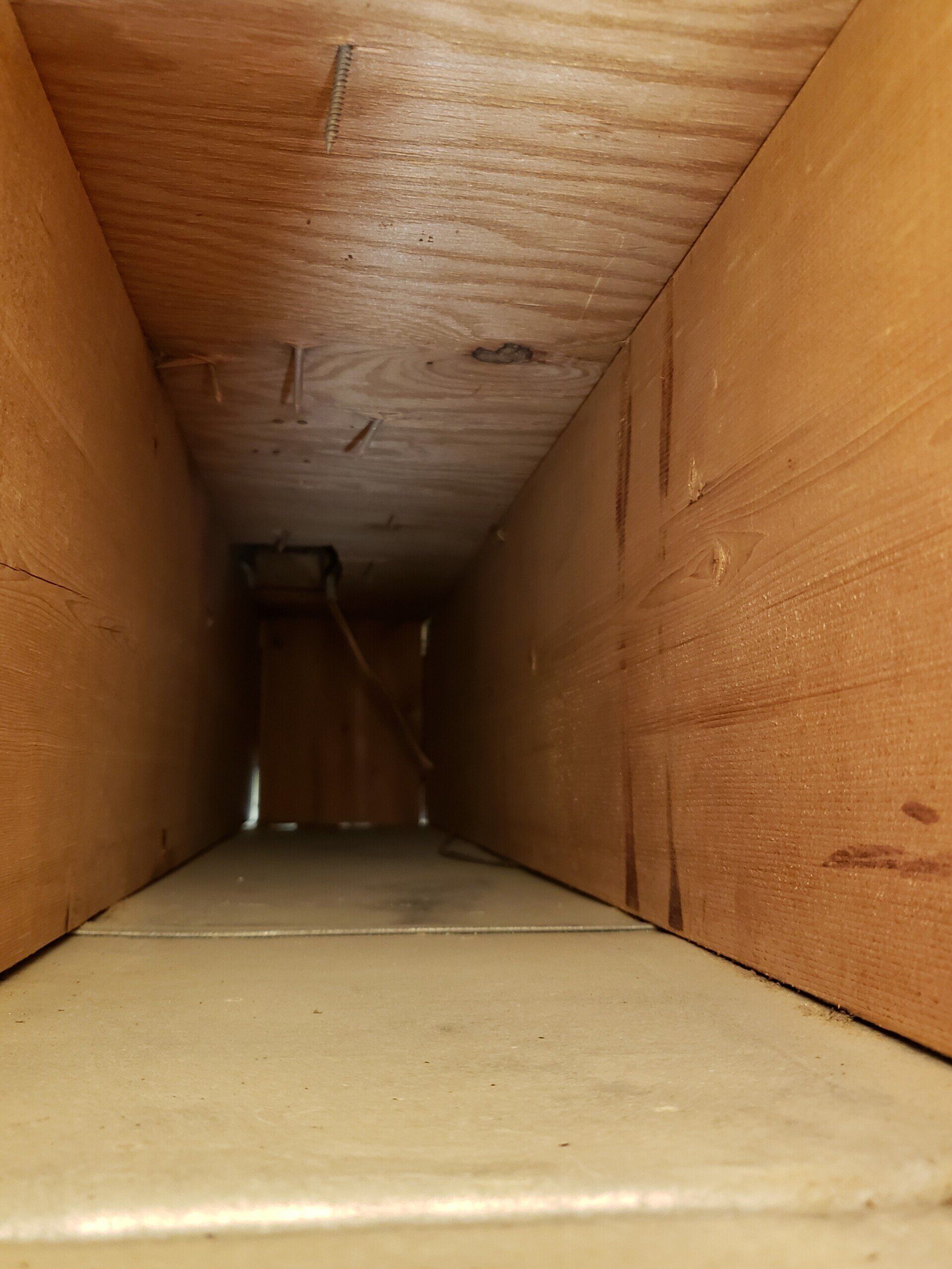 Air duct cleaning in joist run after