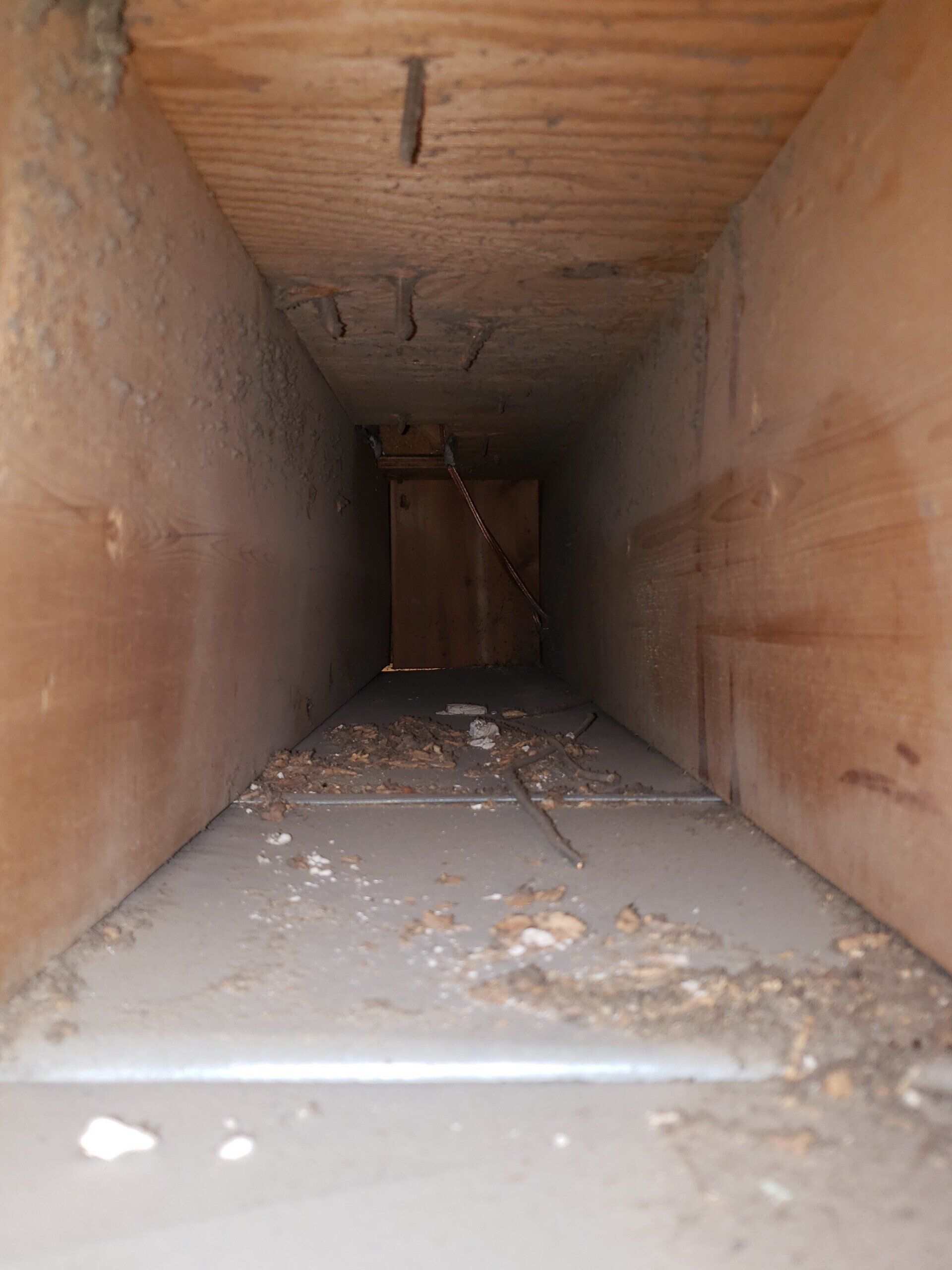 Air duct cleaning in joist run before