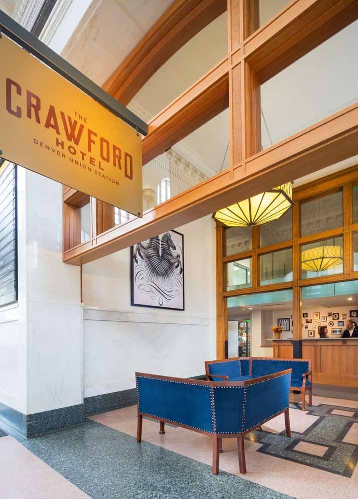 a hotel lobby with a sign that says crawford hotel
