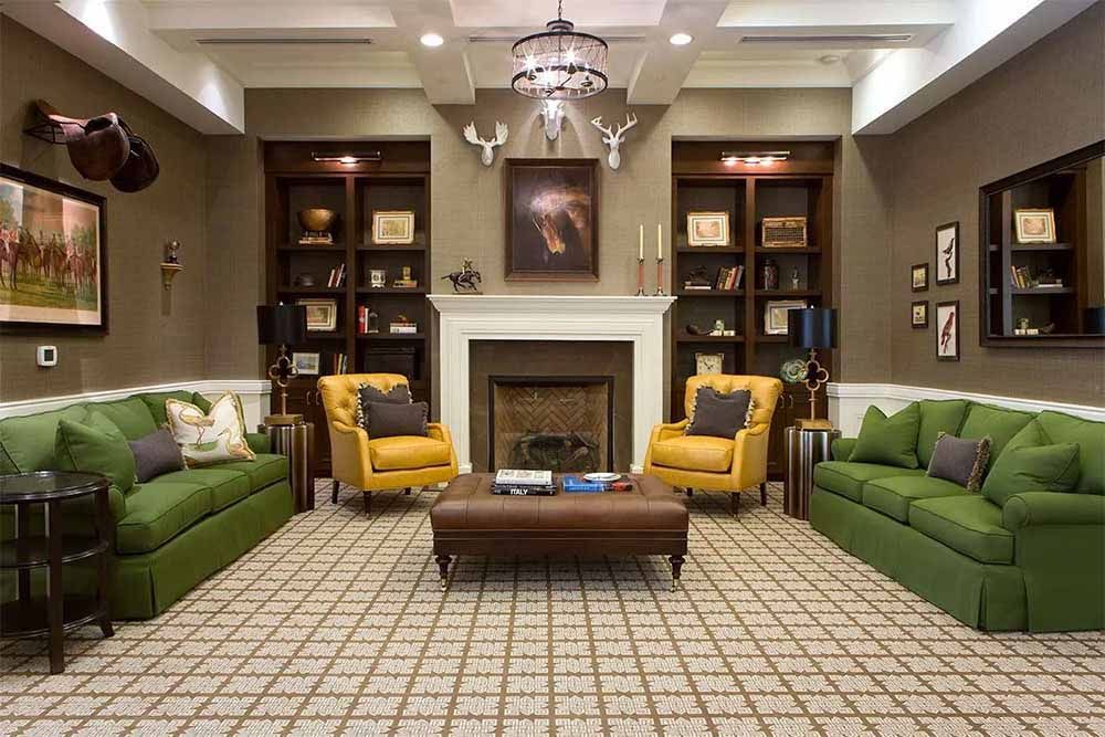 a living room filled with furniture and a fireplace