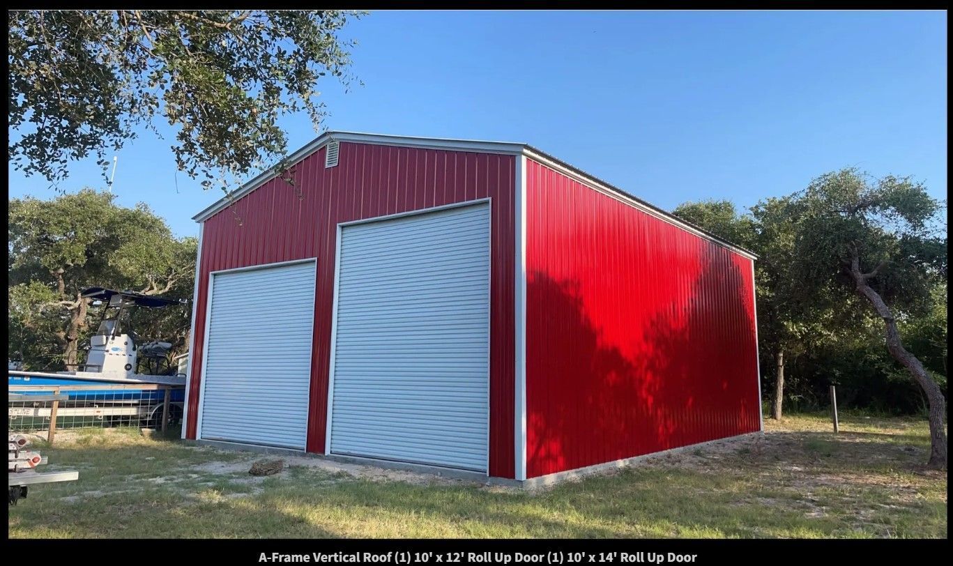 A red barn with white doors and a boat in the background