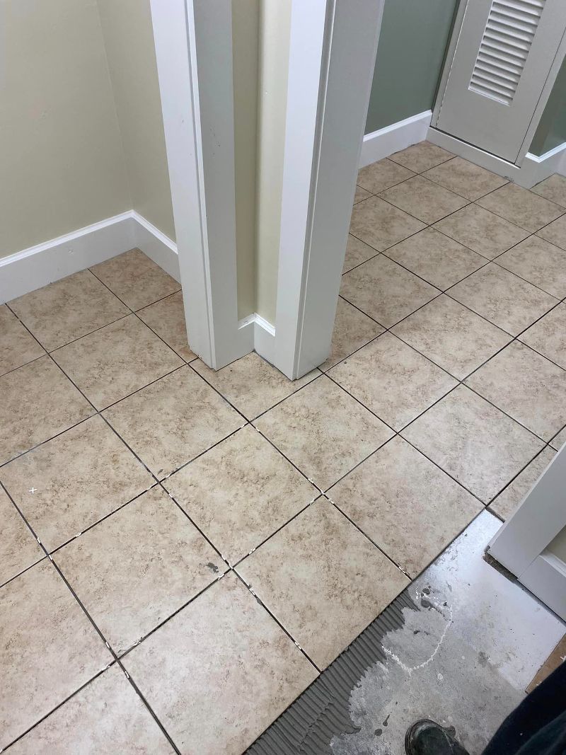 A close up of a tiled floor in a room.