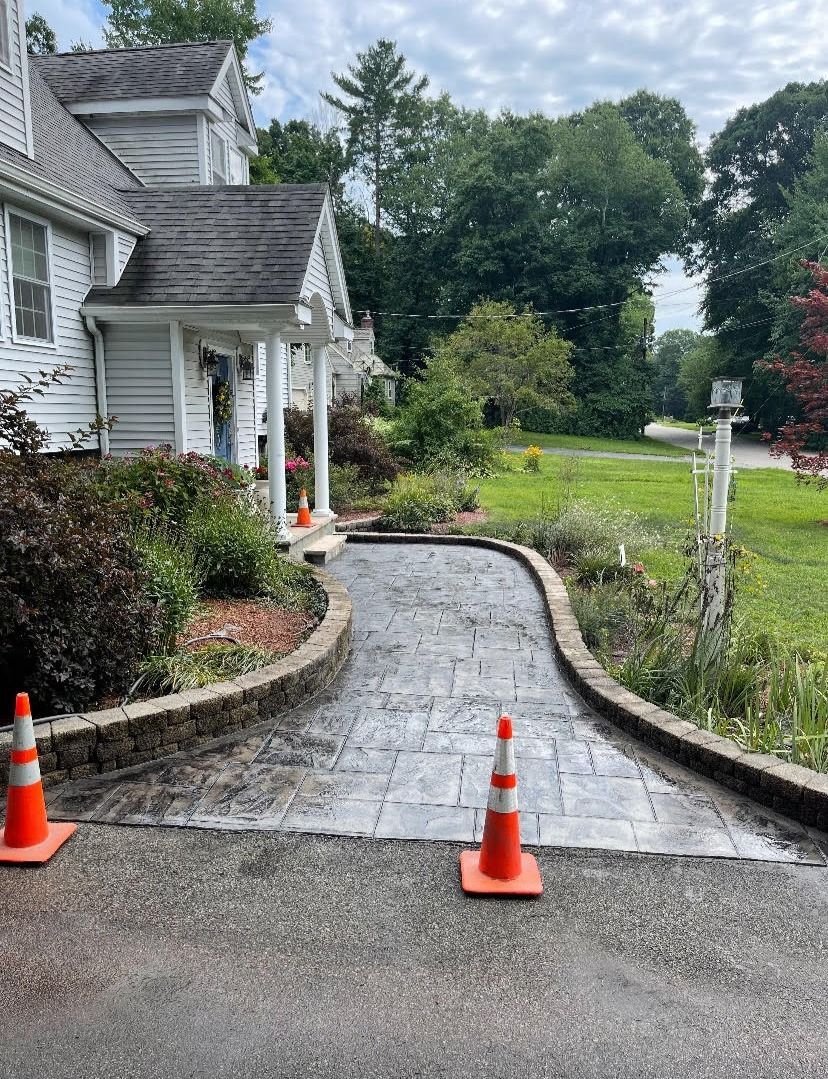 A white work truck parked outside Norfolk Hardware at night, with a load in the bed.