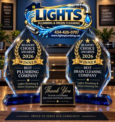 Lights Plumbing & Drain Cleaning awards display with two 2026 Best Plumber trophies and a thank-you plaque