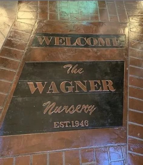 Tile floor sign reading “Welcome to the Wagner Nursery Est. 1940”