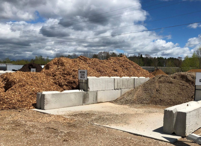 Large piles of wood mulch and soil