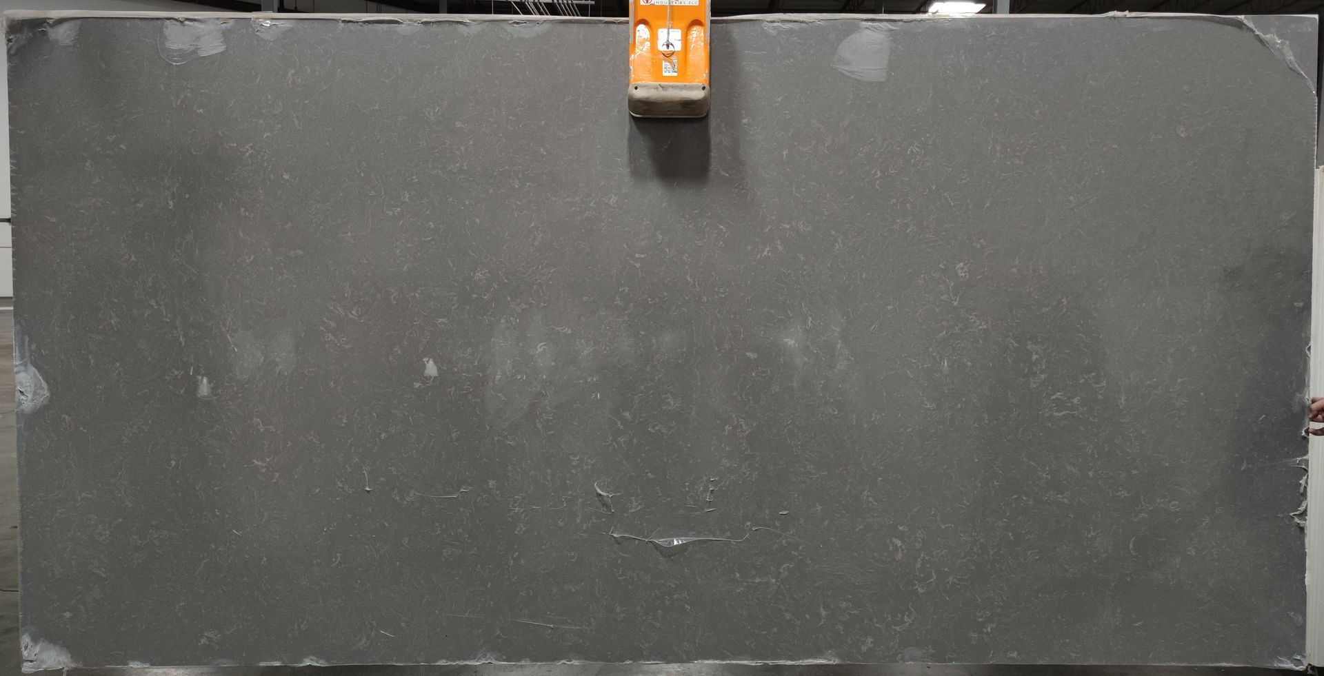 A large black slab of granite is sitting on top of a table.