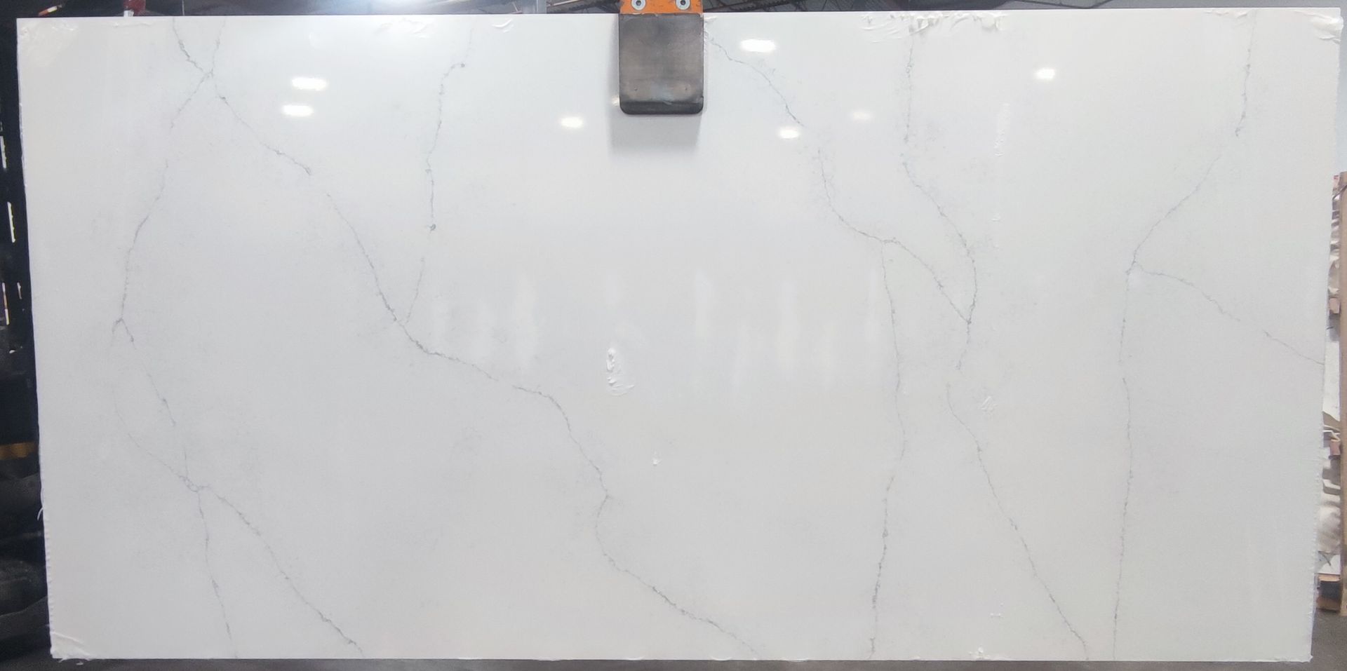 A large white slab of marble is sitting on top of a table.