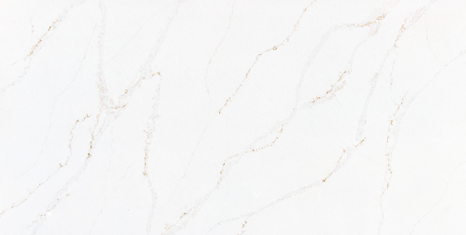 A close up of a white marble texture with a brown vein.