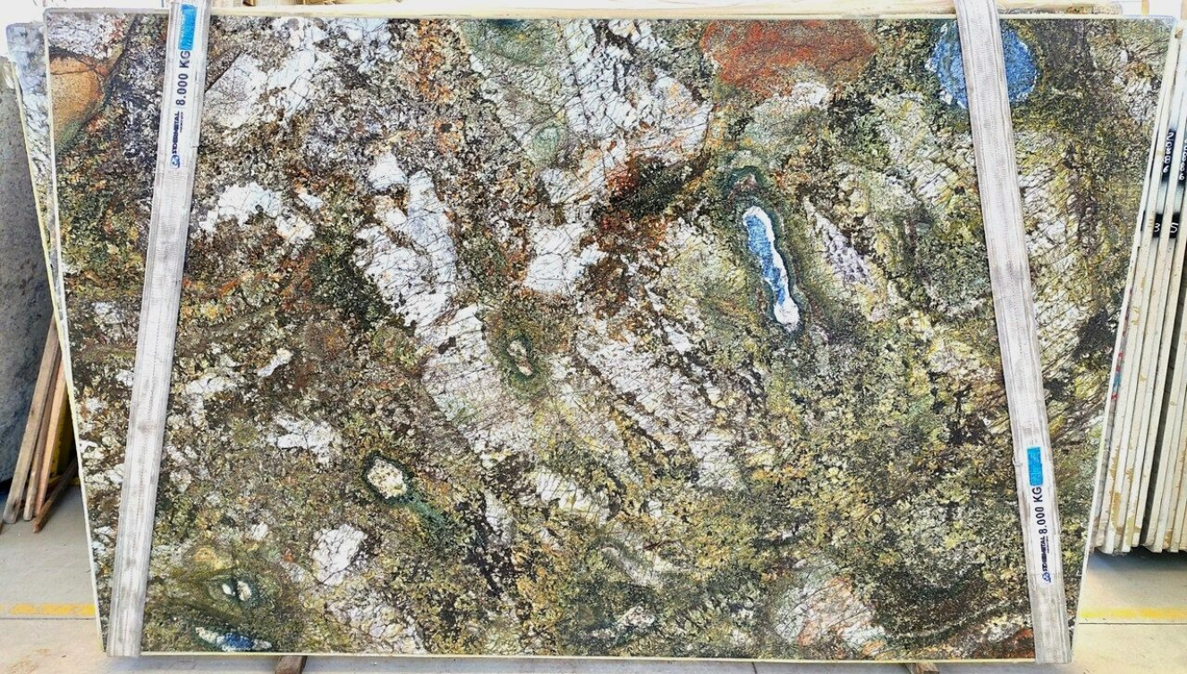 A large piece of granite is sitting on top of a wooden table.