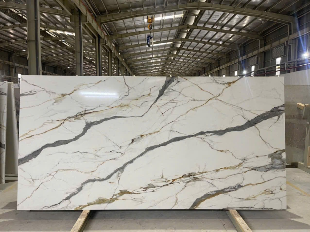 A large white marble slab is sitting in a warehouse.