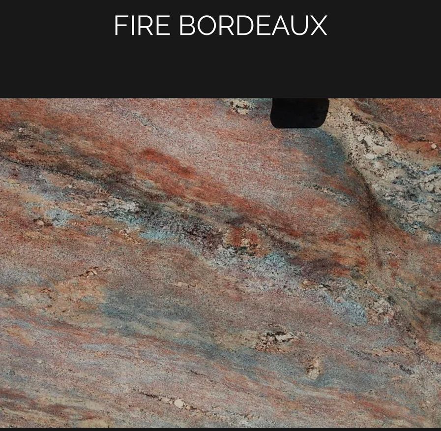 A close up of a fire bordeaux granite counter top.