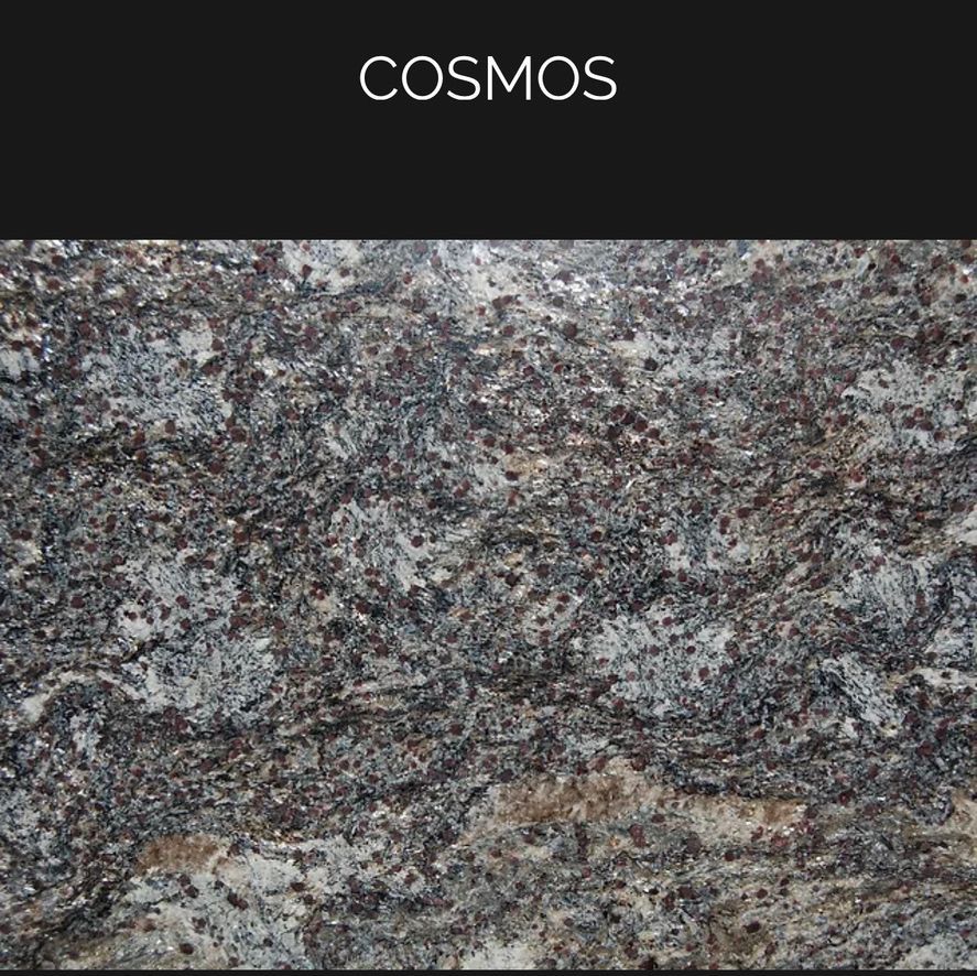 A close up of a granite counter top with the word cosmos on it.