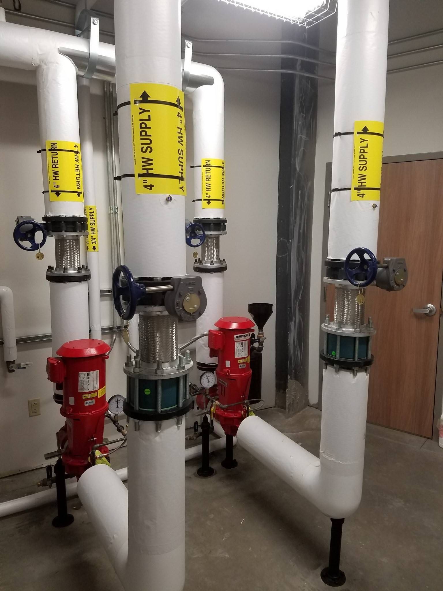 A bunch of pipes with one that says 'aire' on it