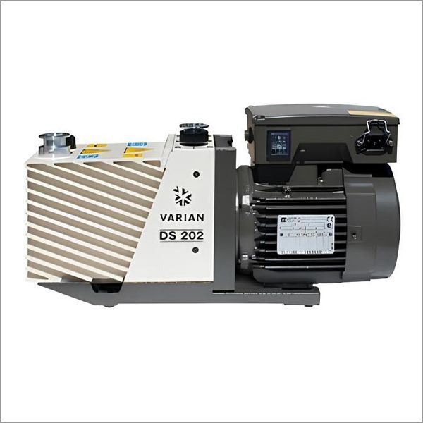 Varian DS 202 vacuum pump. Gray and white pump with motor, on a white background.