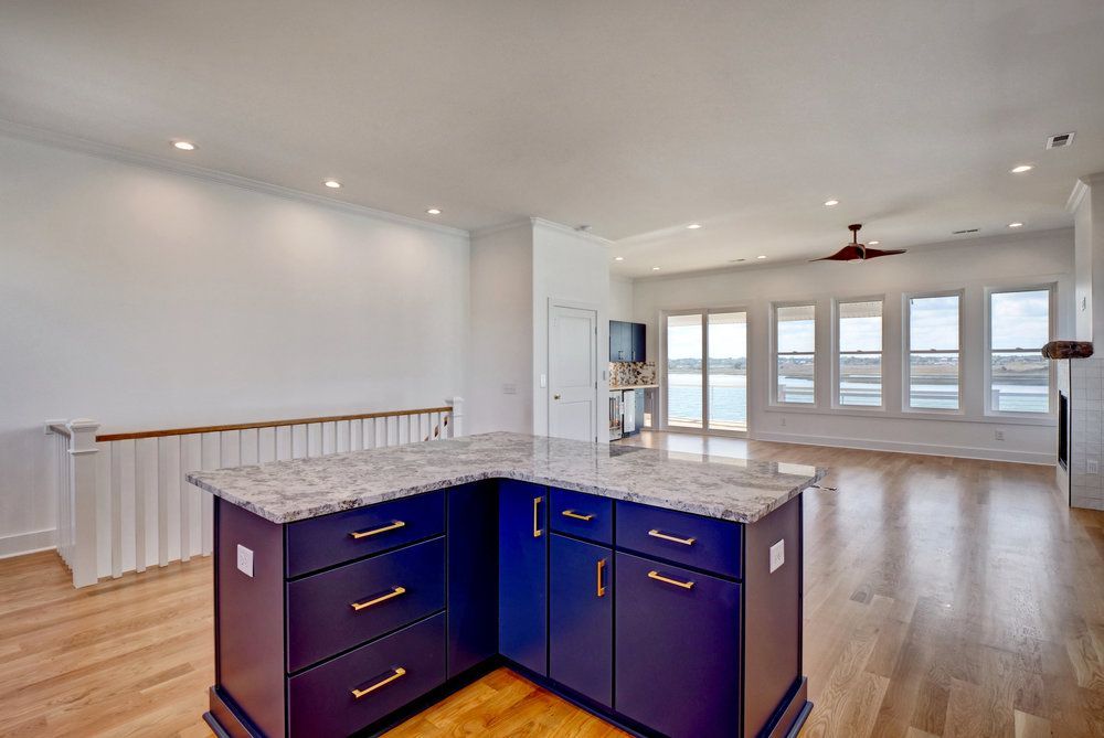 There is a large island in the middle of the kitchen.