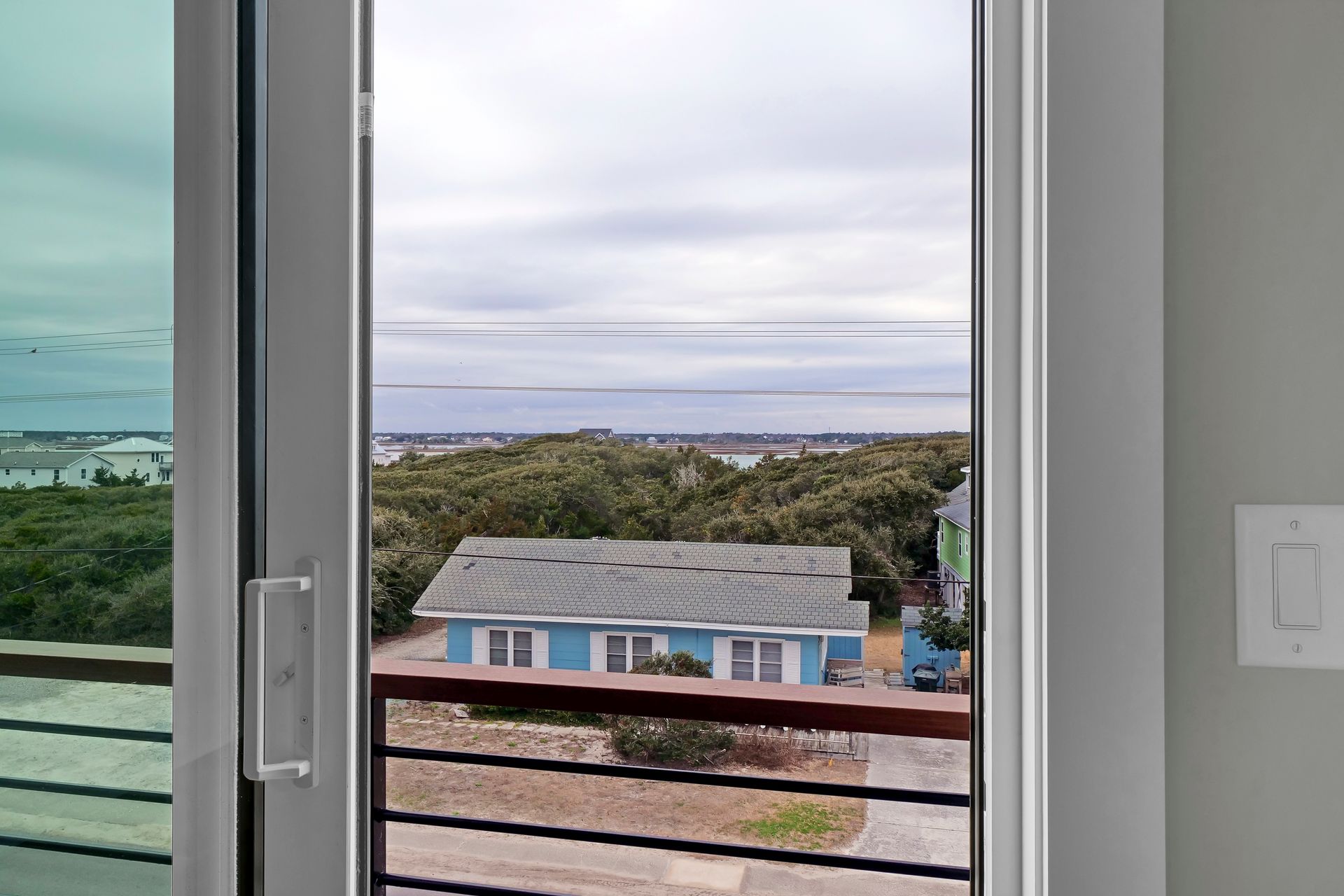 A view of a house from a sliding glass door.
