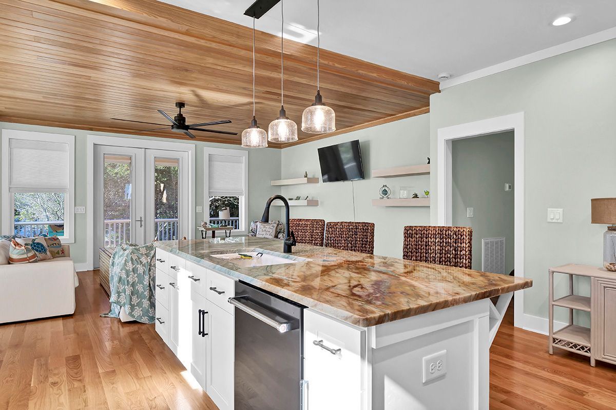 A kitchen with a large island in the middle of the room