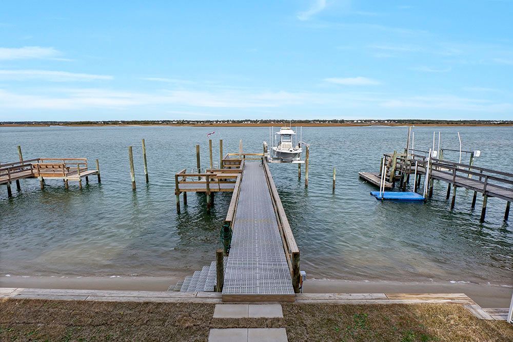 A wooden dock leading into a body of water