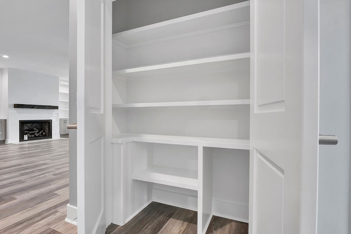 A white closet with shelves