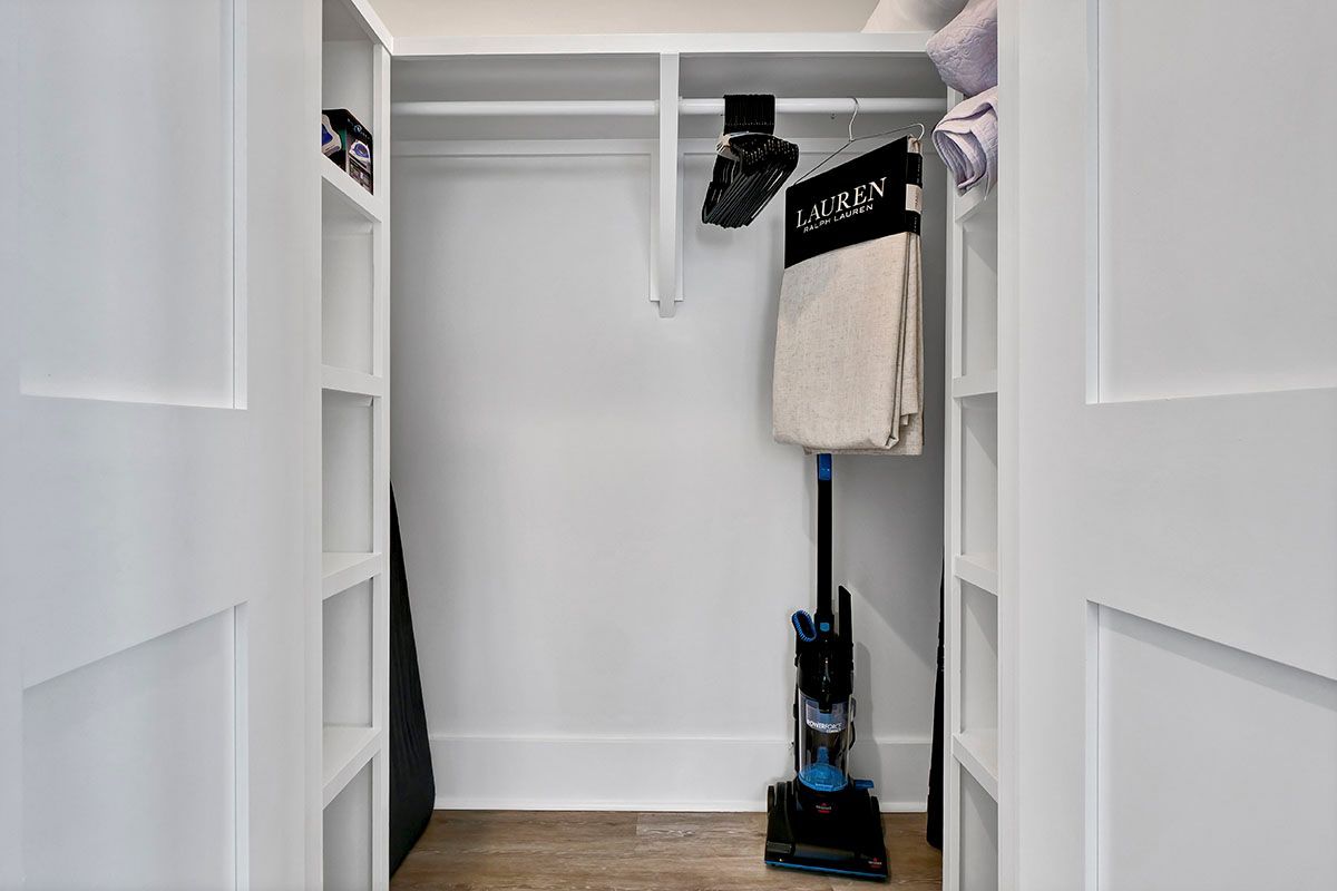 A vacuum cleaner in the closet