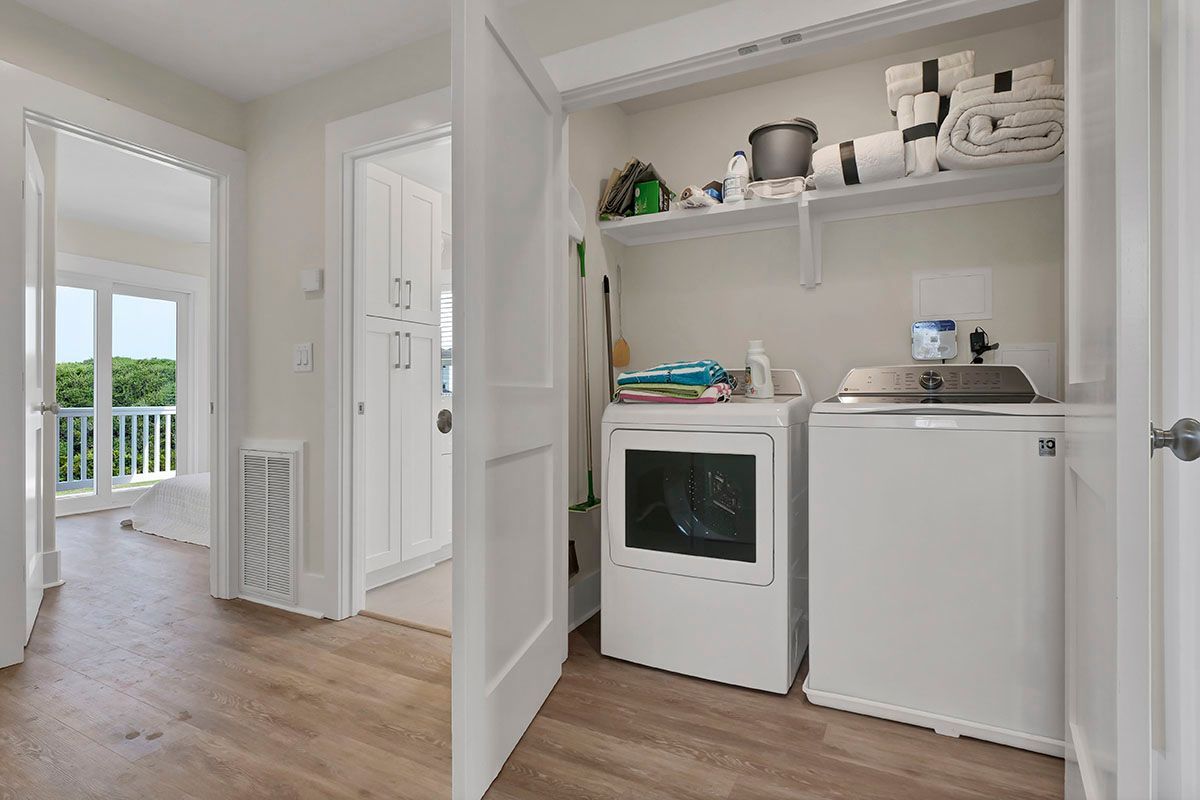 A laundry room with a washer and dryer