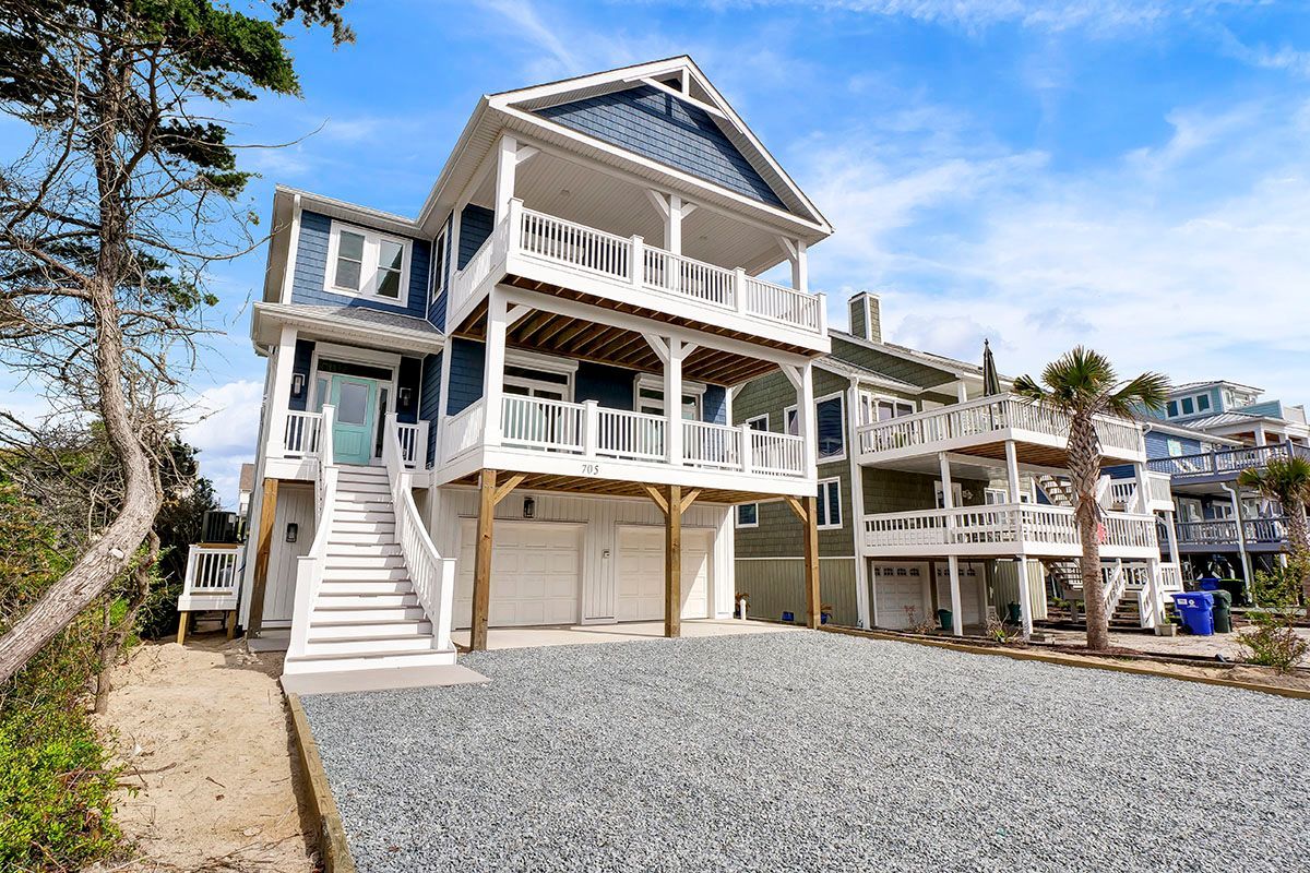 A large house with a lot of windows and stairs