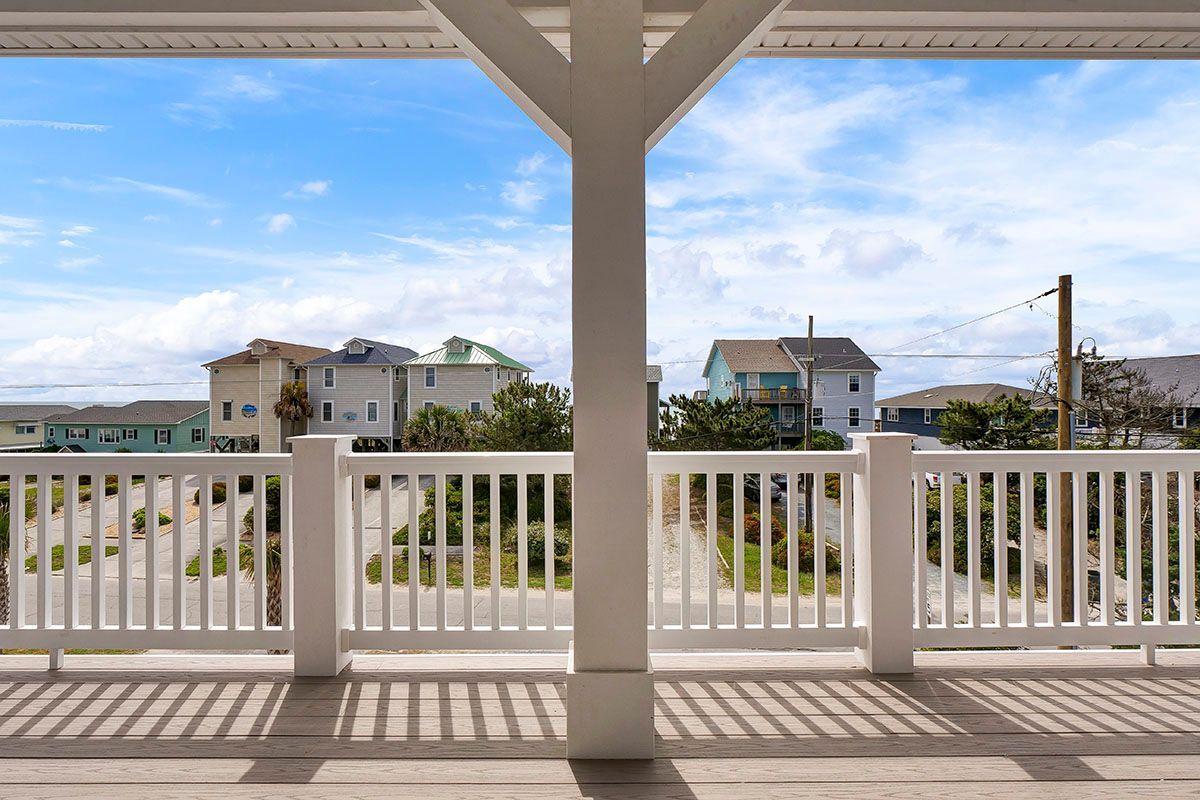 A balcony with a white railing