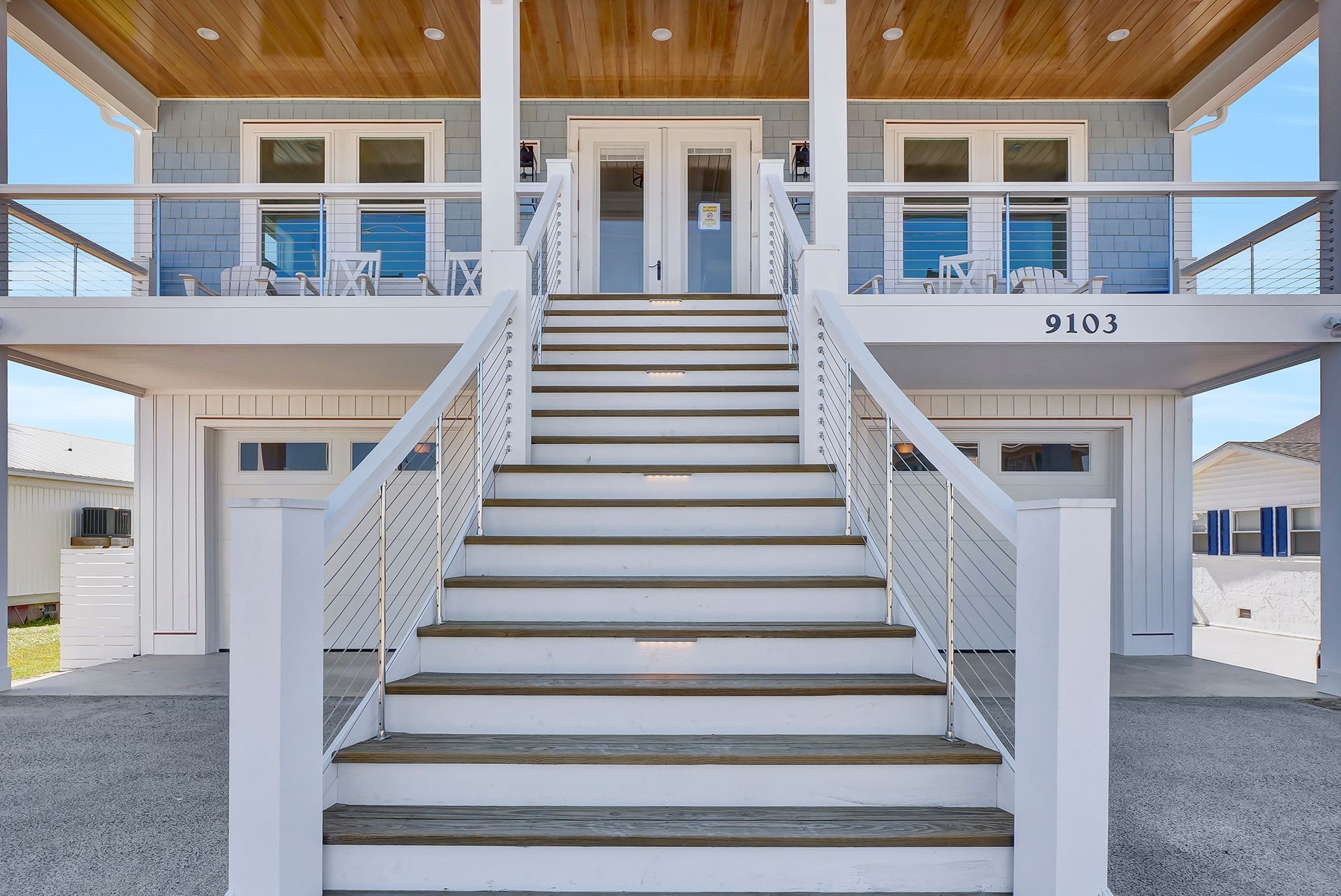 A house with stairs leading up to the front door