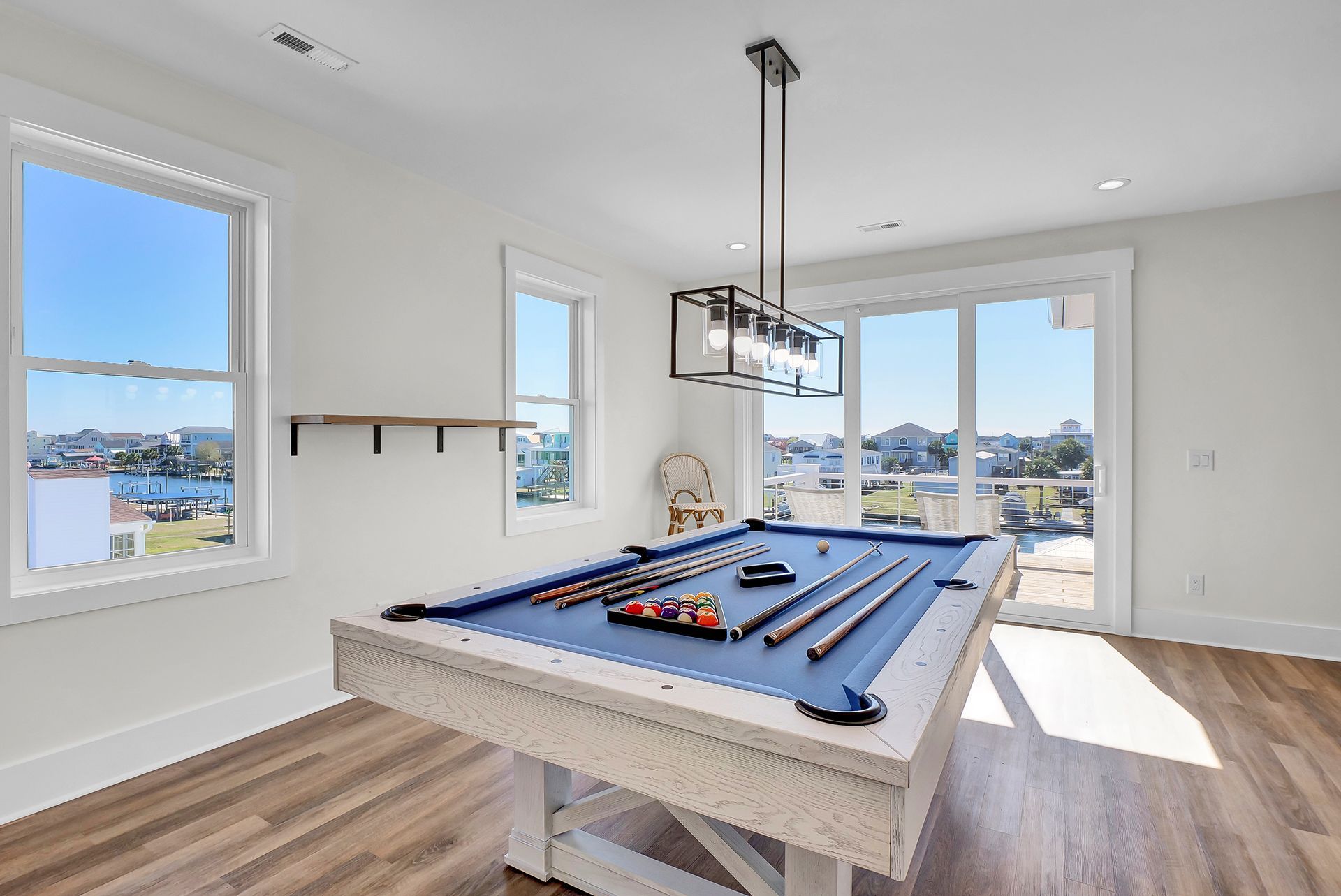 A pool table in the middle of a room