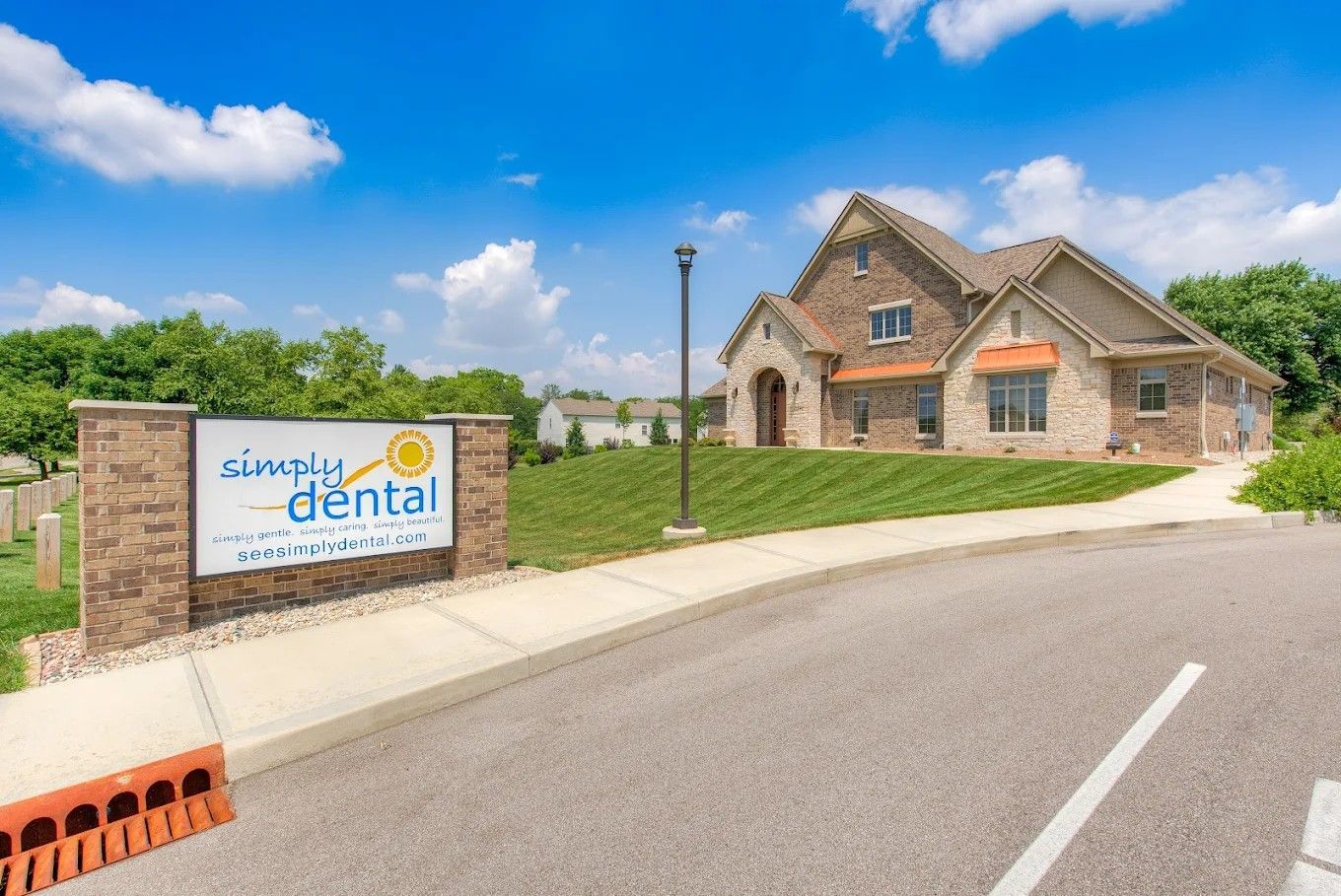 Simply Dental office exterior with signage and building.