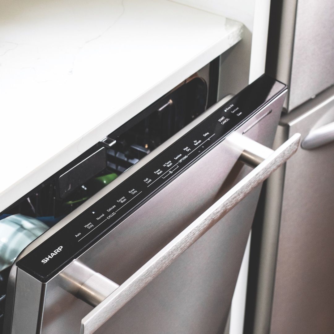 A stainless steel dishwasher with the door open