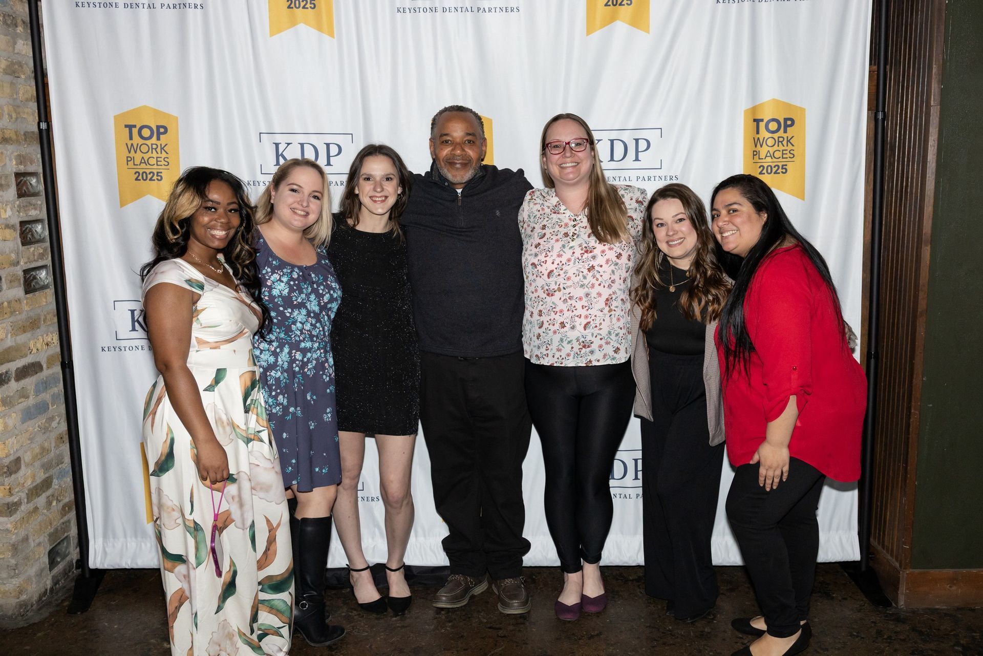 A group of people are posing for a picture.