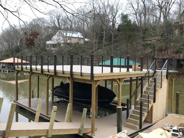 A boat is in a dock with stairs leading up to it
