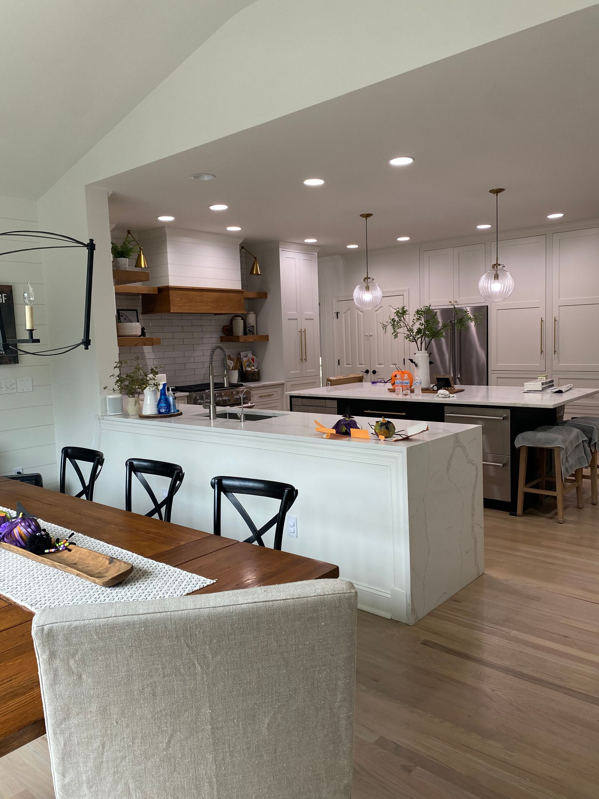 A kitchen with a table and chairs in it