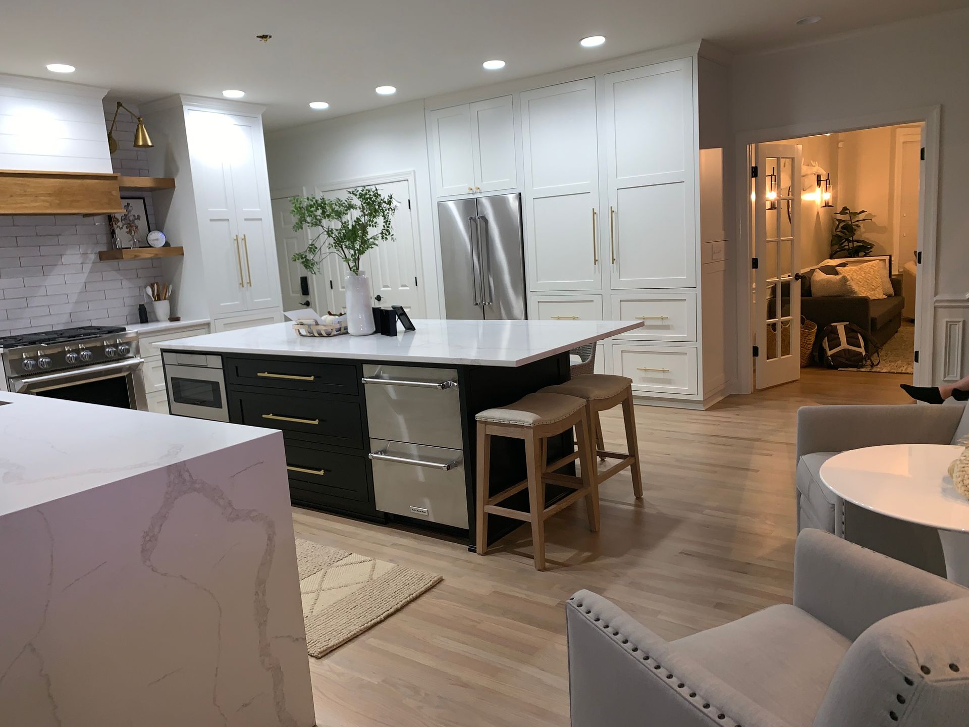 There is a large island in the middle of the kitchen.