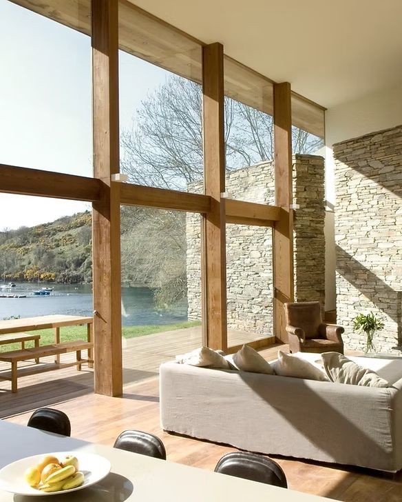 A living room with a couch and a large window