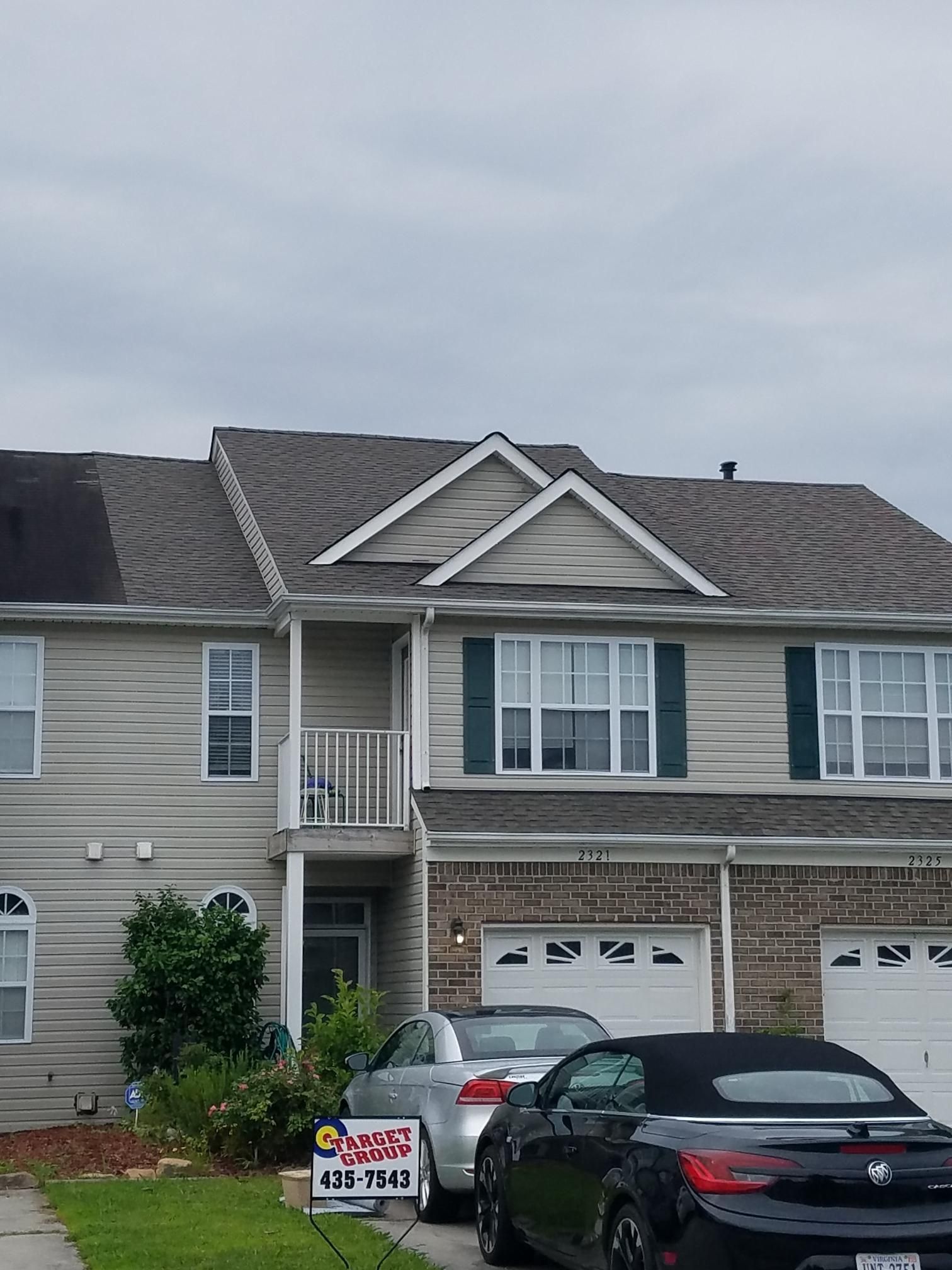 A house with a for sale sign