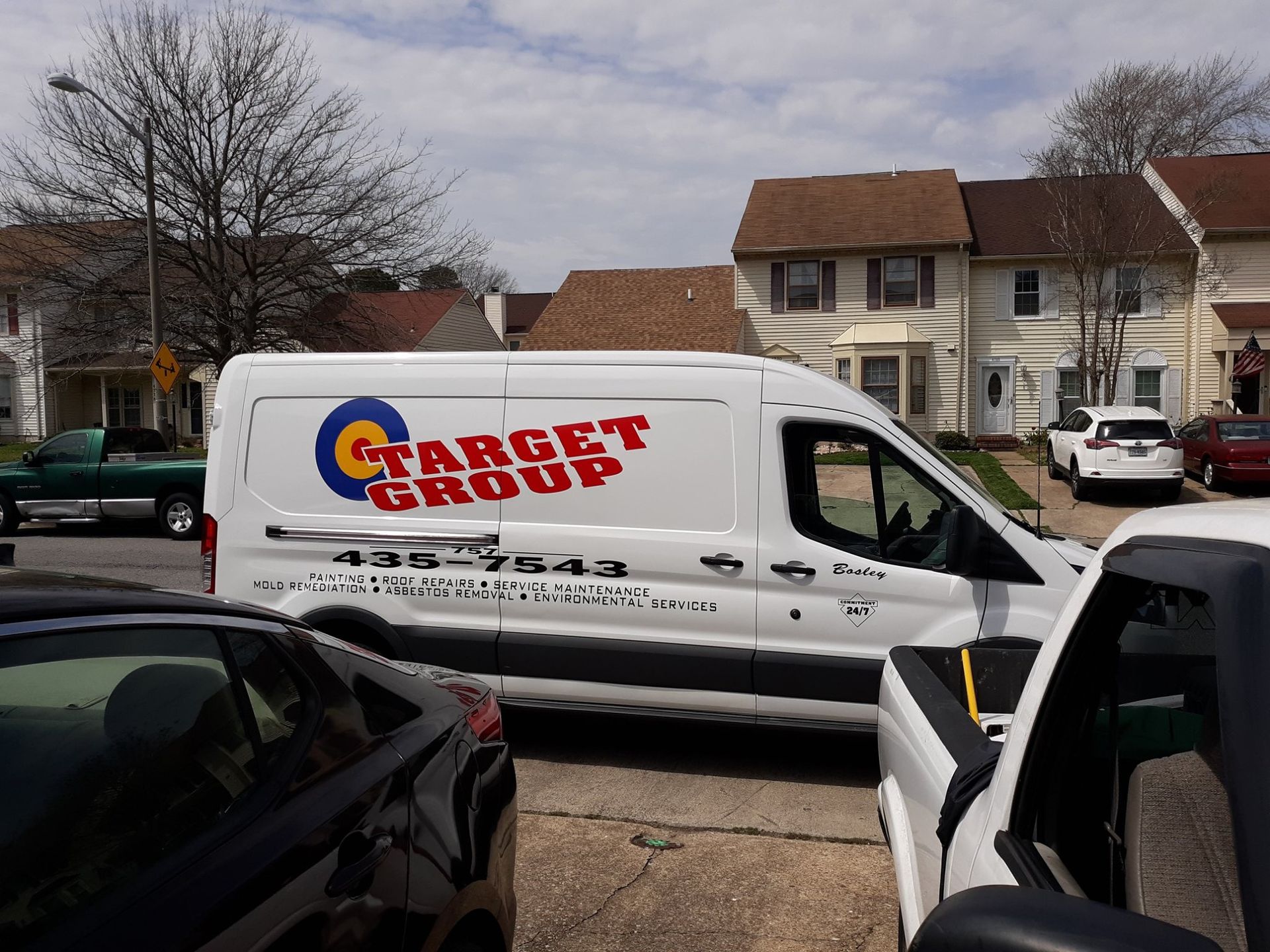 A target group van is parked on the side of the road