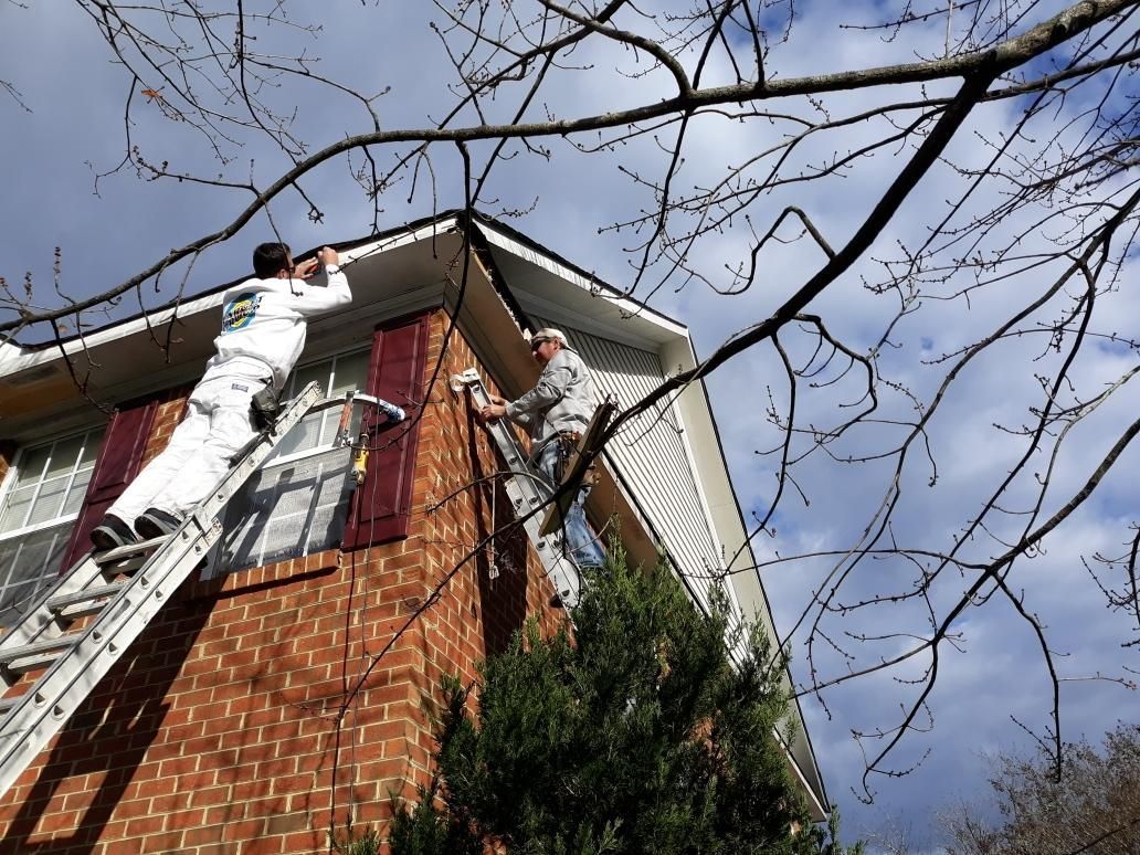 Two men are painting