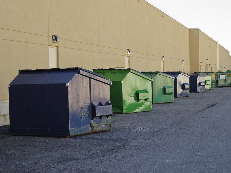 dumpsters behind a commercial building