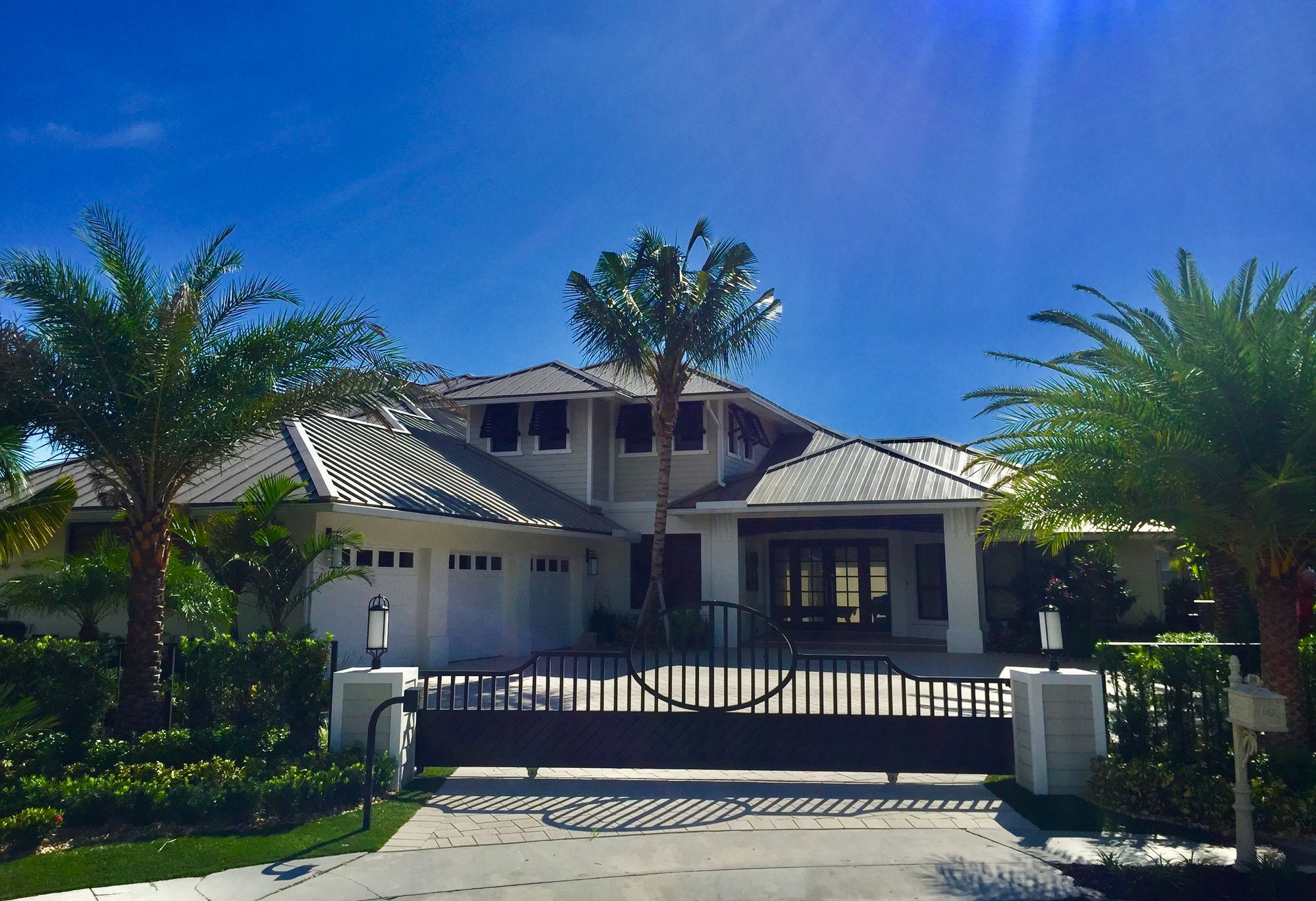 A large house with palm trees in front of it