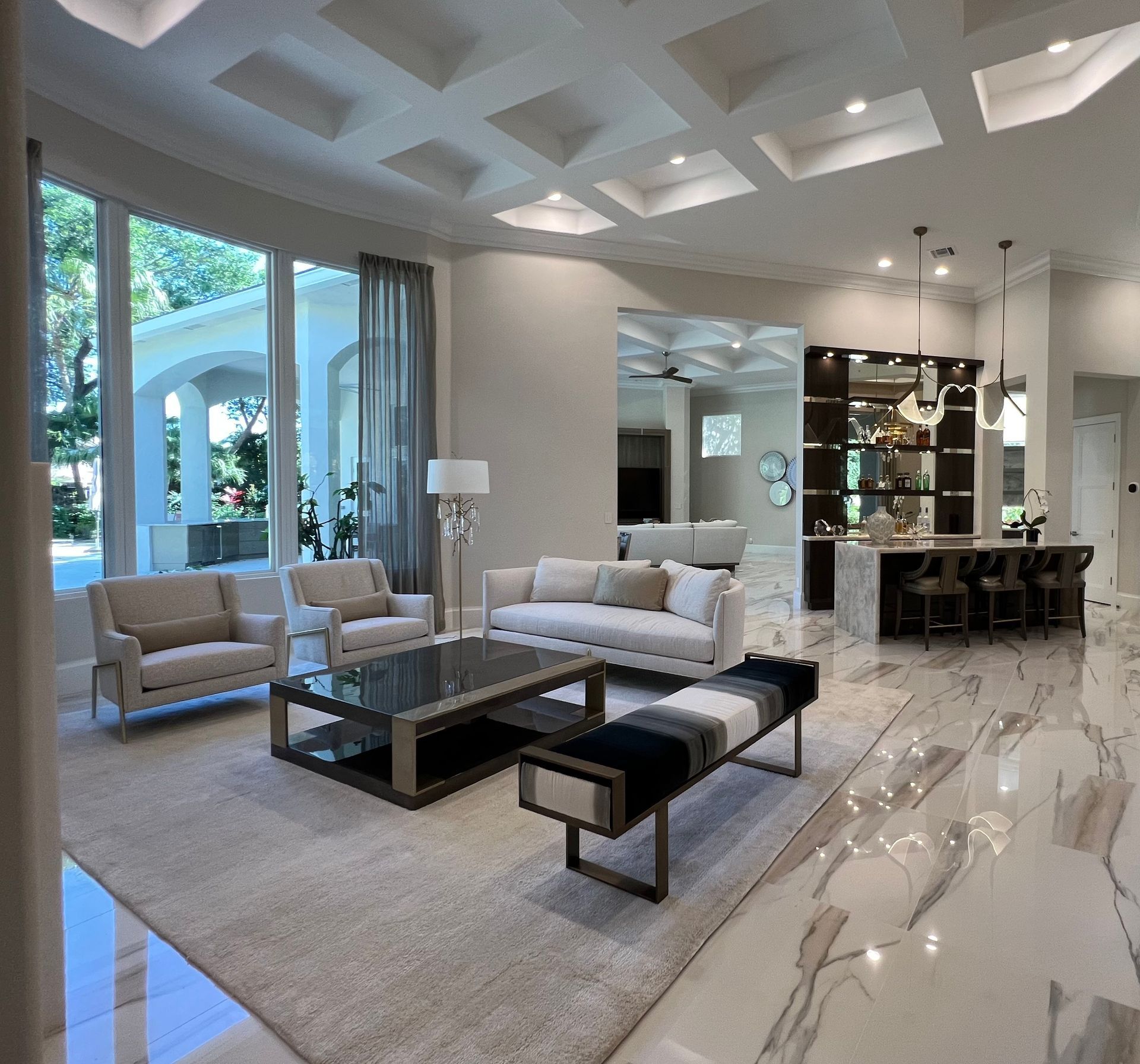 A living room with a couch and chairs and a coffee table