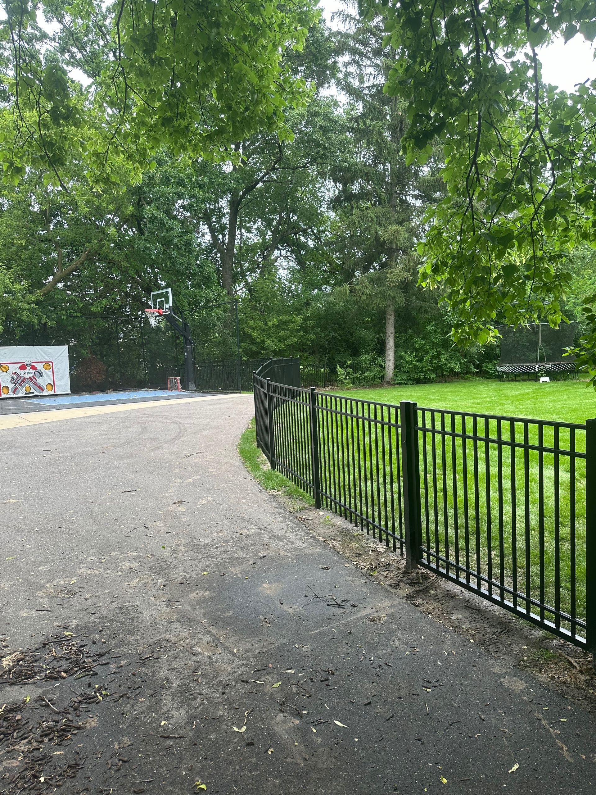 A path leading to a basketball court in a park