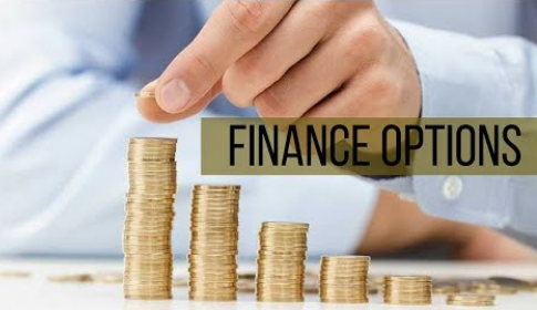 Hand placing a coin on a stack; Finance Options text overlaid on image, stacks decreasing in size.