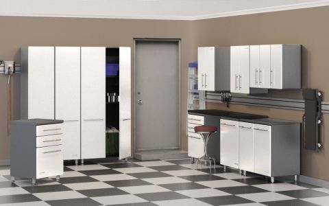 Garage with white cabinets, black countertop, and checkered floor.